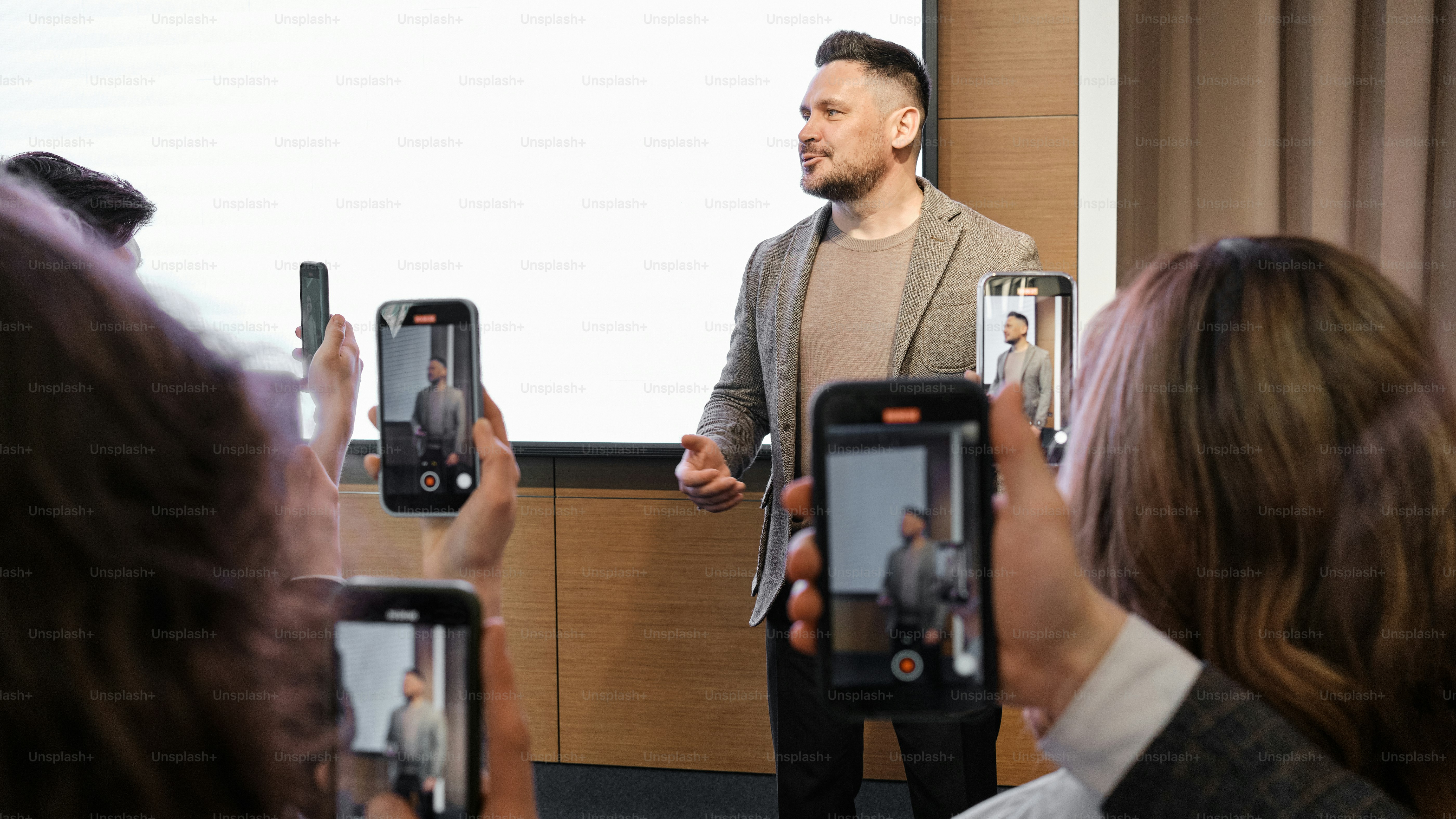a man giving a presentation to a group of people