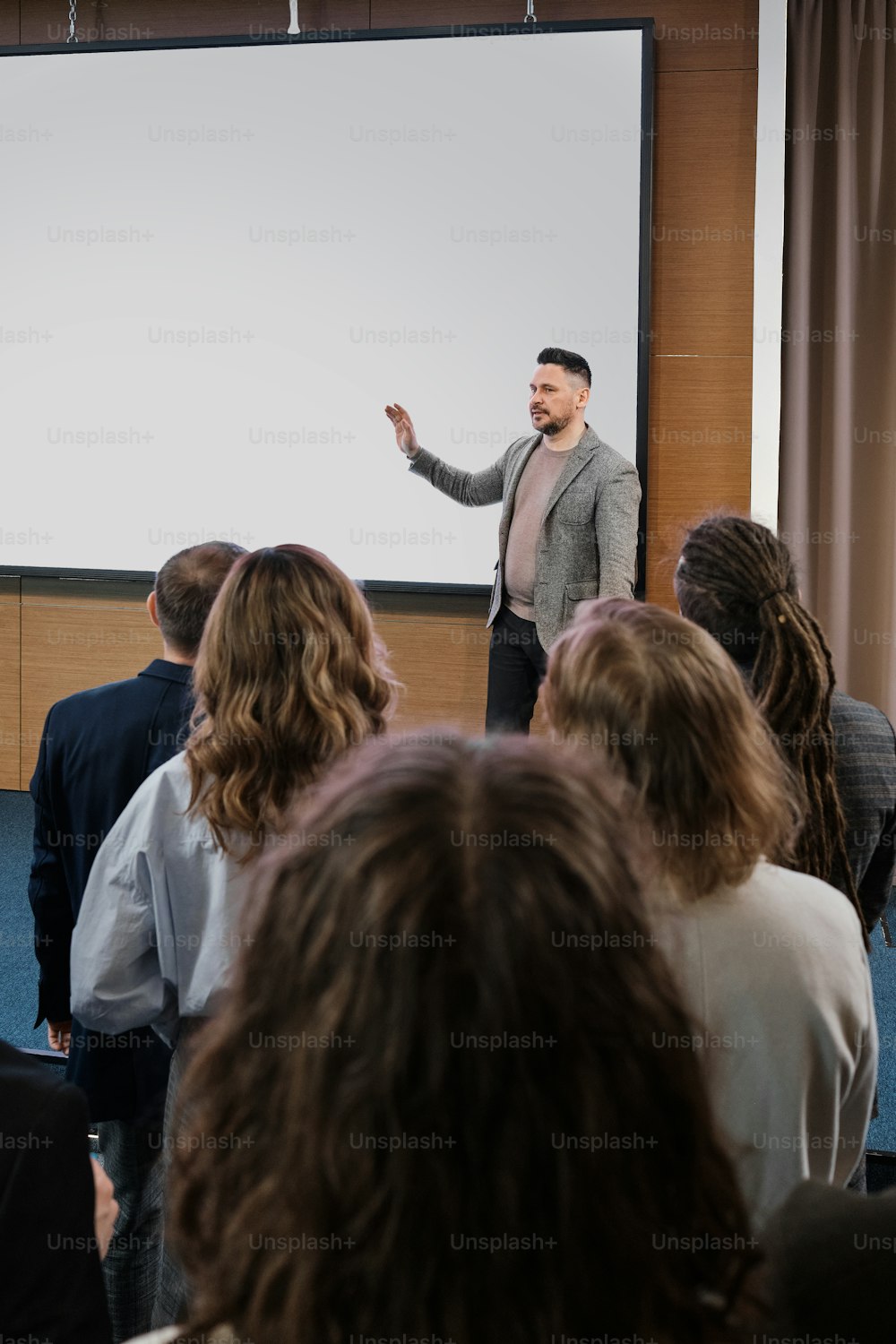 a man giving a presentation to a group of people
