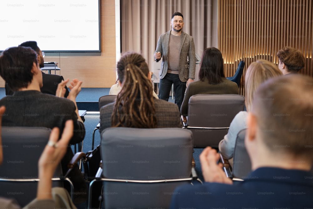 a man standing in front of a group of people