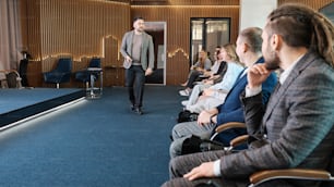 a man standing in front of a crowd of people