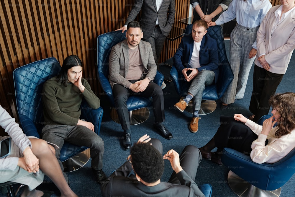 a group of people sitting around each other