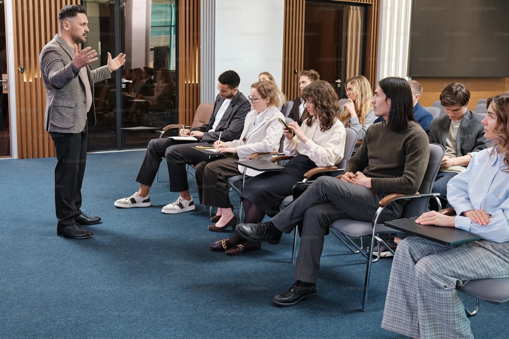 a man giving a presentation to a group of people