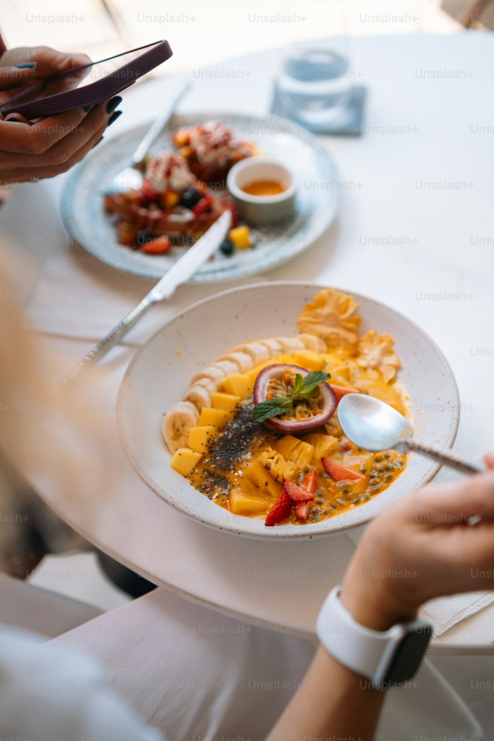 a plate of pasta on a white table