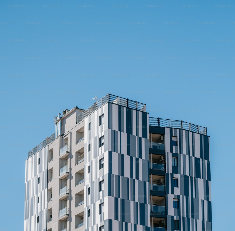 a very tall building with a sky background