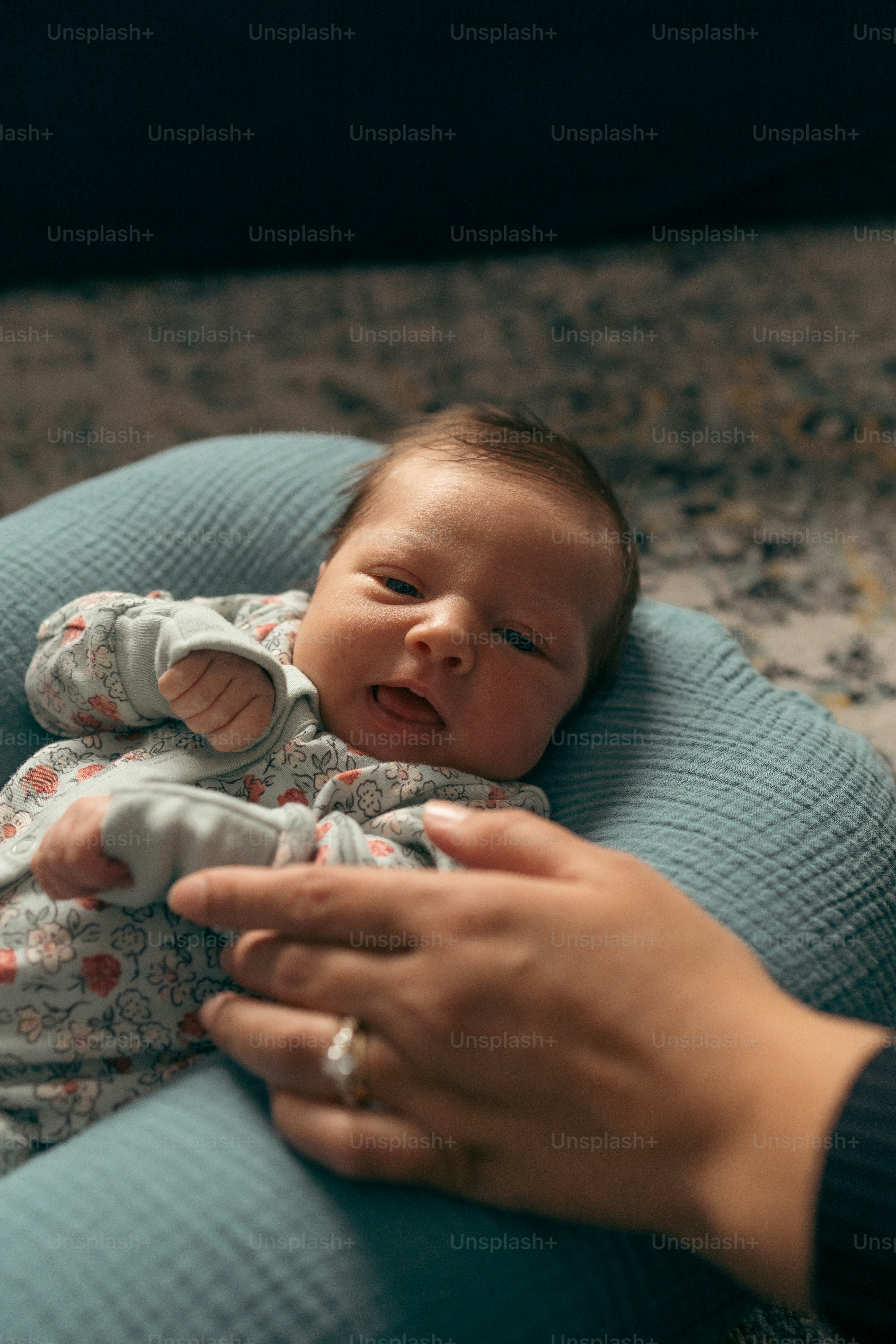 a woman holding a baby in her arms