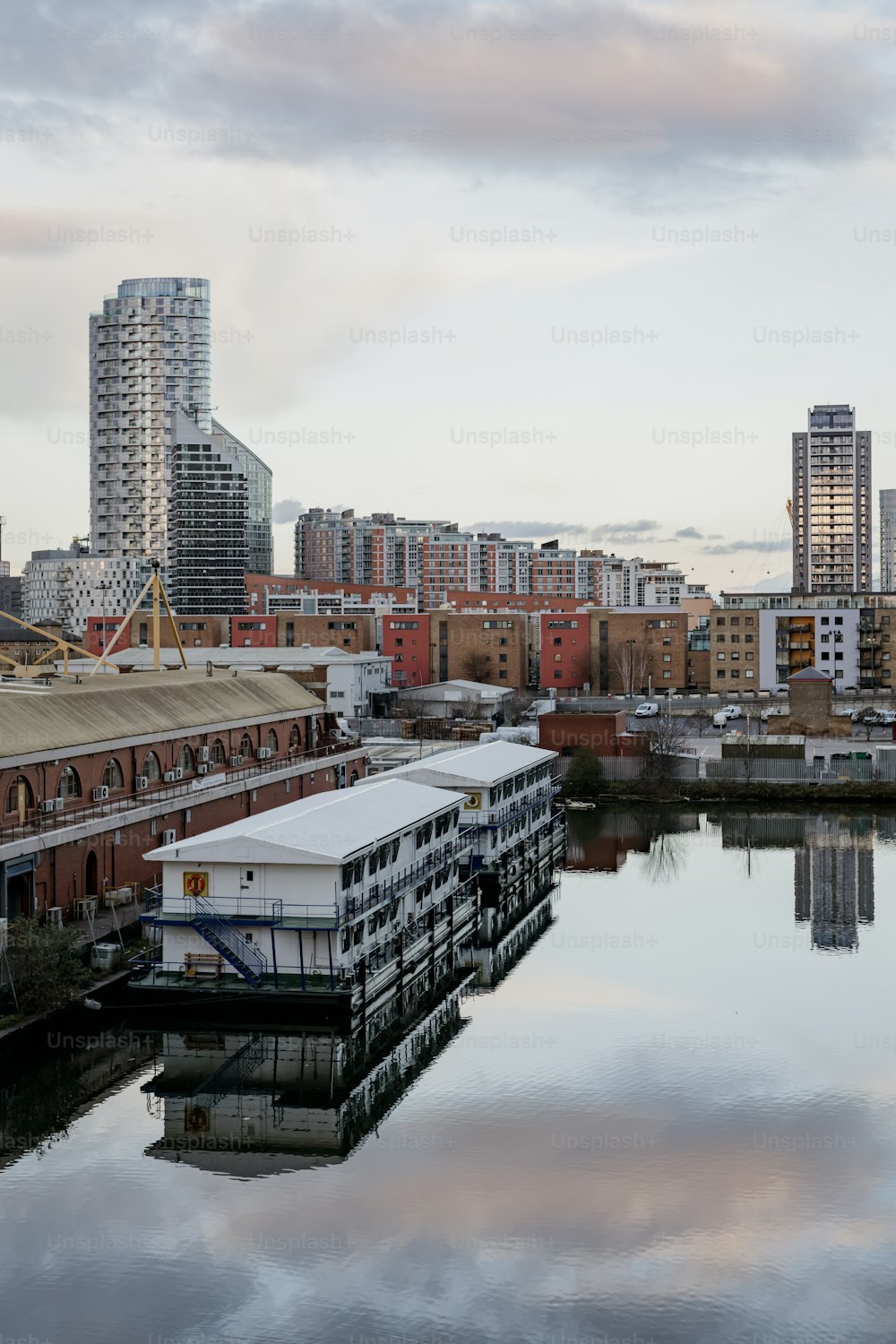 a body of water with buildings in the background