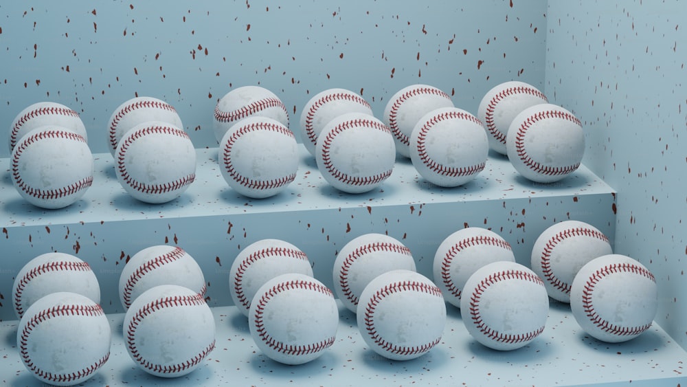 a group of baseballs sitting on top of a shelf