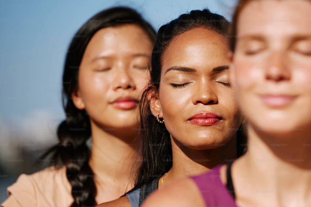 a group of young women standing next to each other