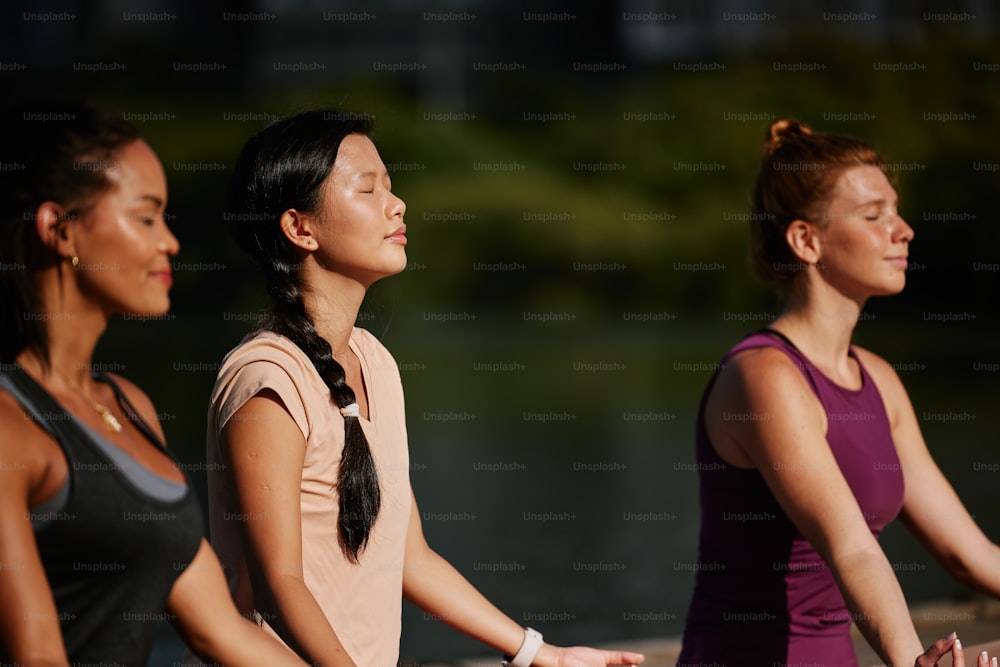 a group of women standing next to each other