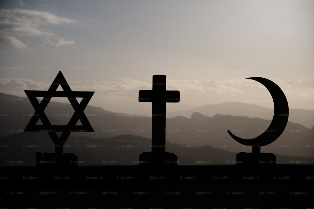 a cross, a star of david, and a crescent of david