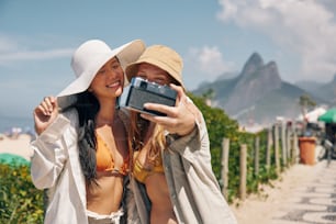 a couple of women standing next to each other