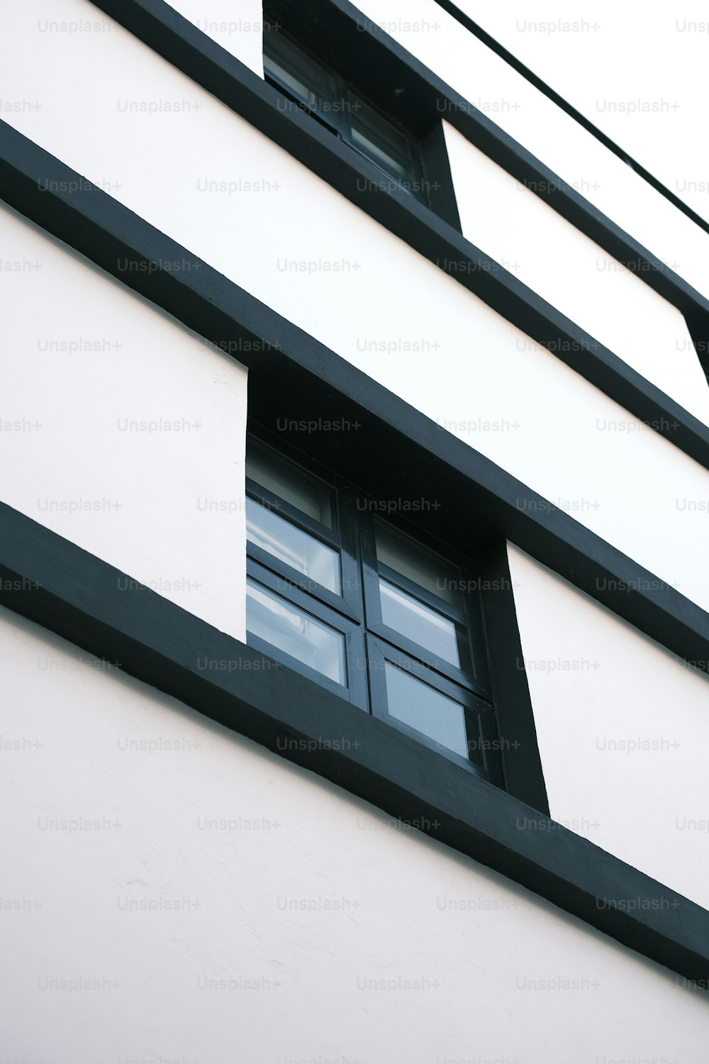 a black and white building with two windows