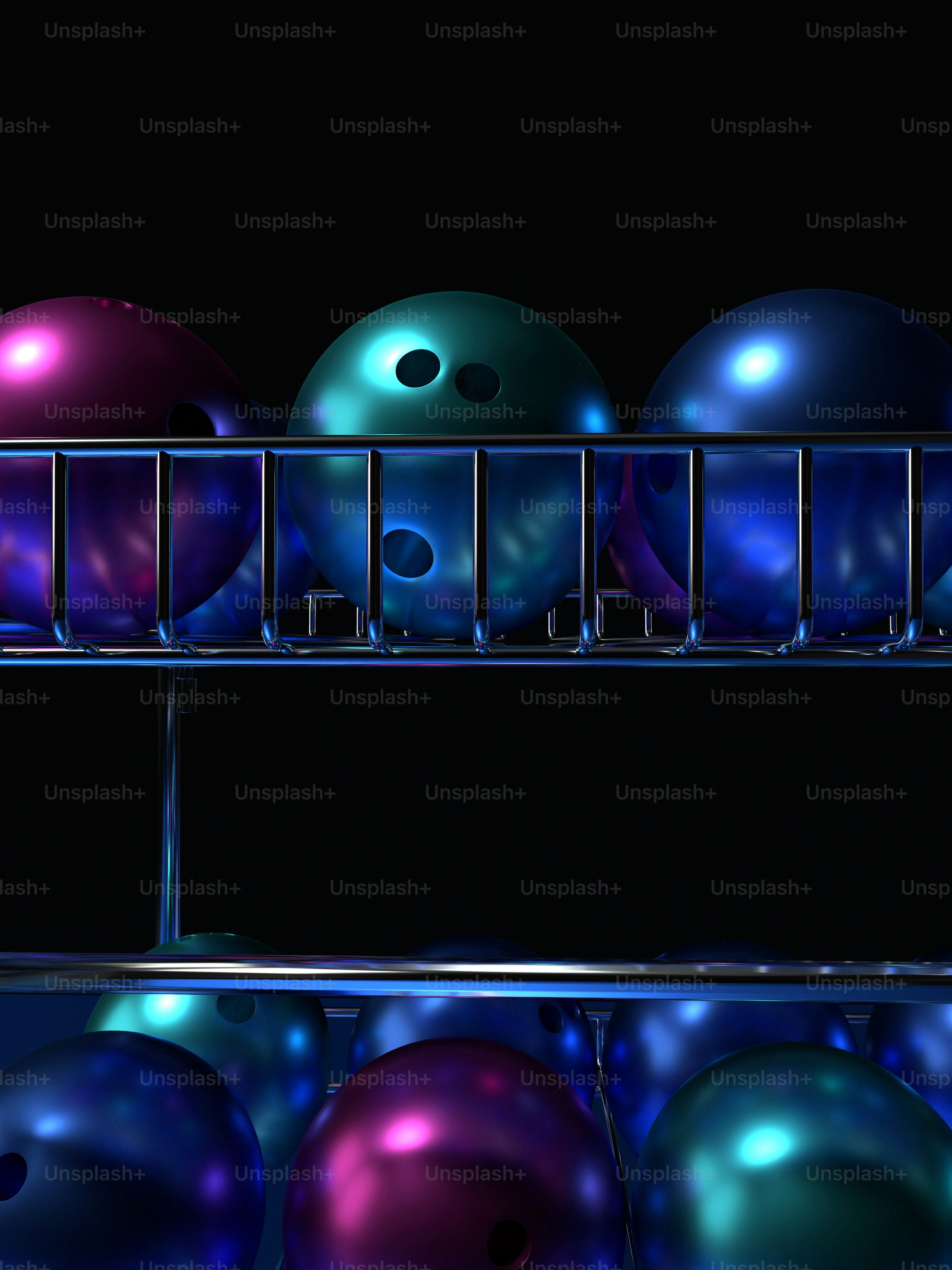 a row of bowling balls sitting on top of a rack