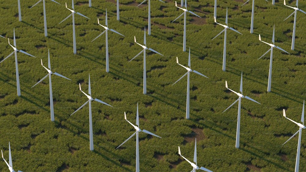 an aerial view of a field of wind turbines