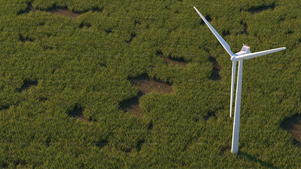 an aerial view of a wind turbine in a green field