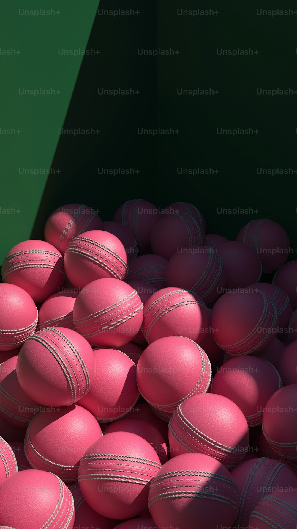 a pile of pink balls sitting next to each other