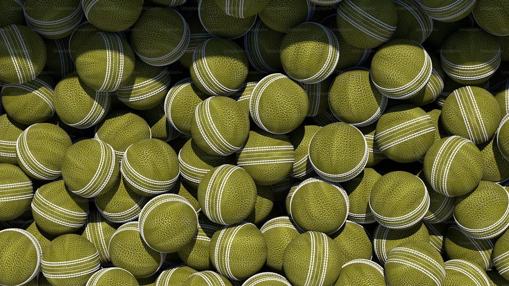 a large pile of tennis balls stacked on top of each other