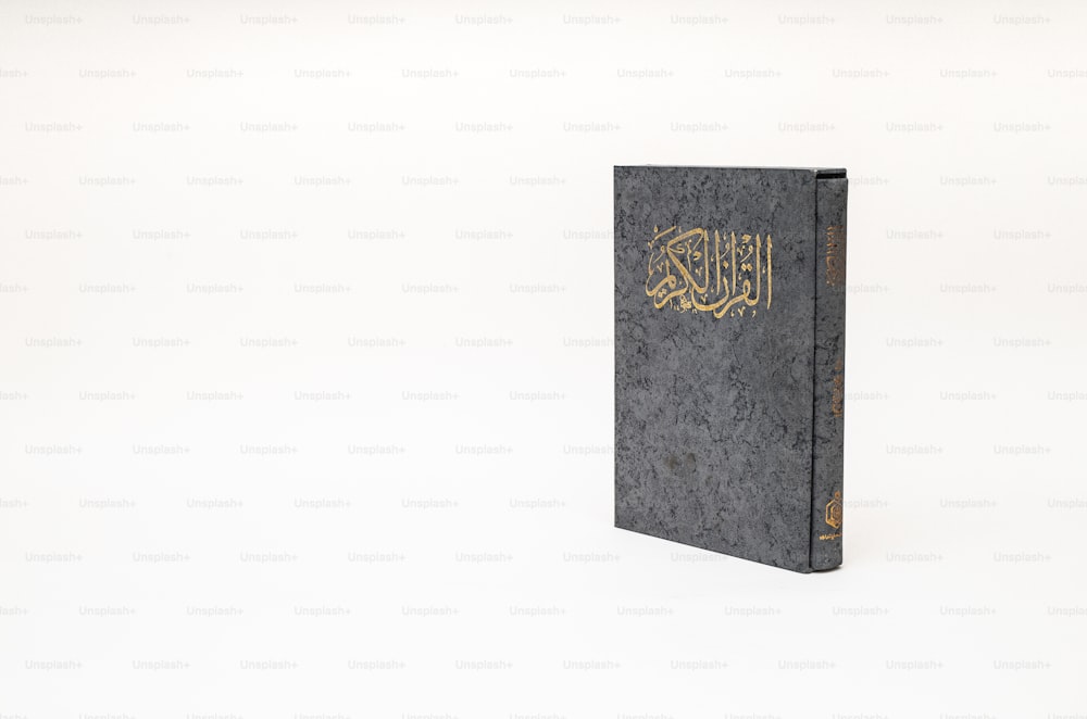 a black book with gold writing on it