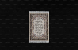 a white rug with a black background