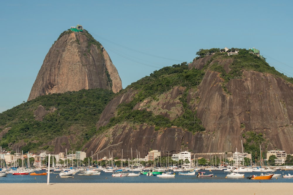 a group of boats floating on top of a body of water