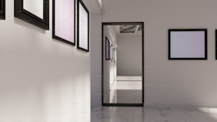 a hallway with a mirror and pictures on the wall