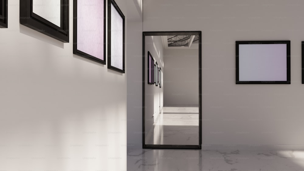 a hallway with a mirror and pictures on the wall