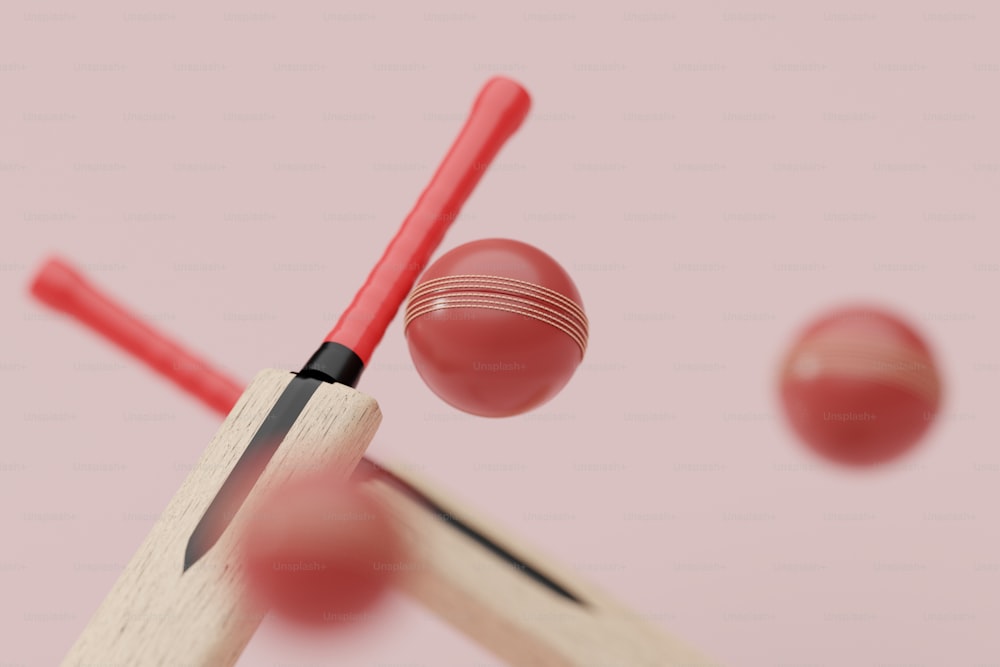 a close up of a cricket bat and a ball
