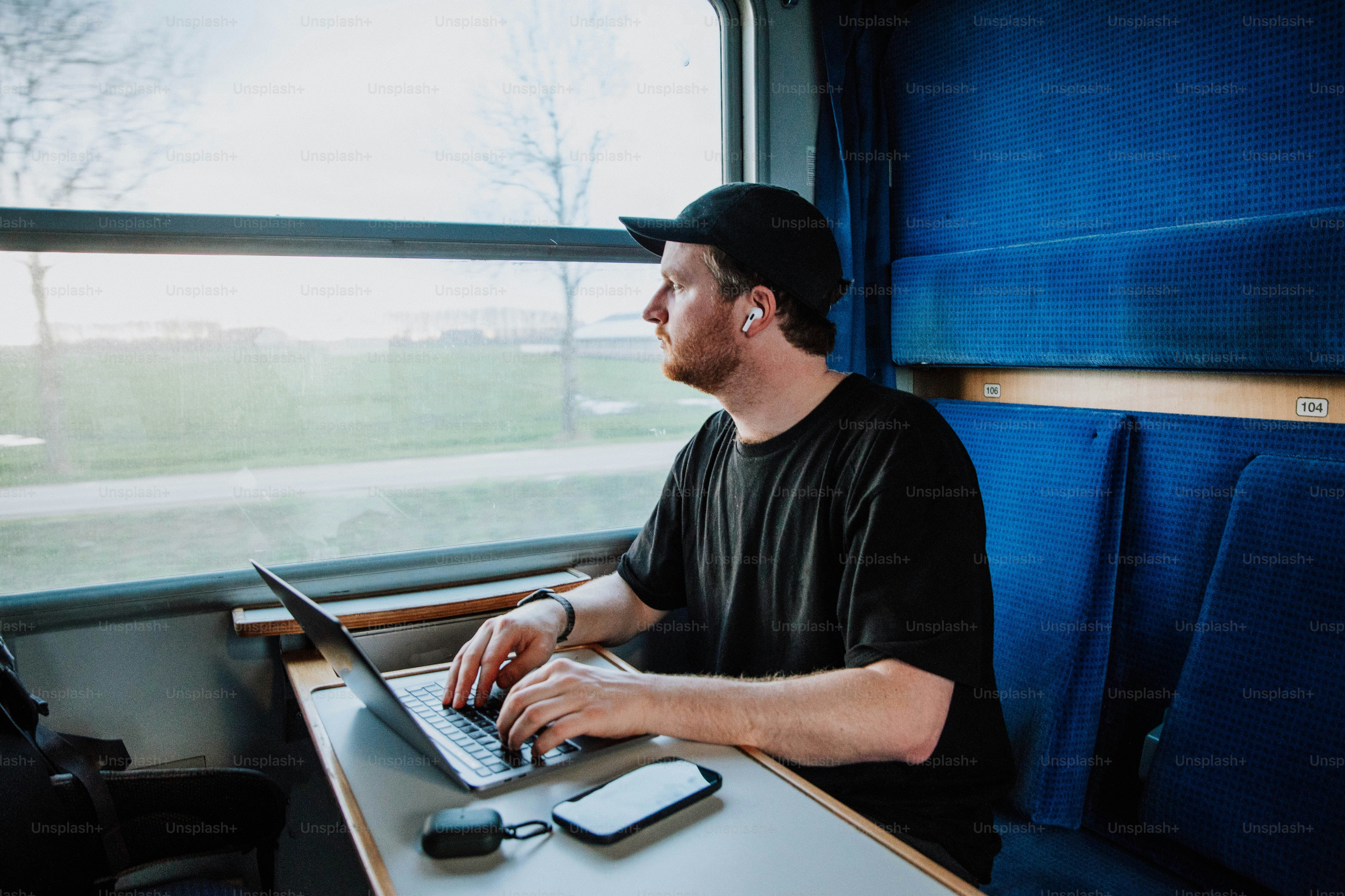 a man sitting in front of a laptop computer