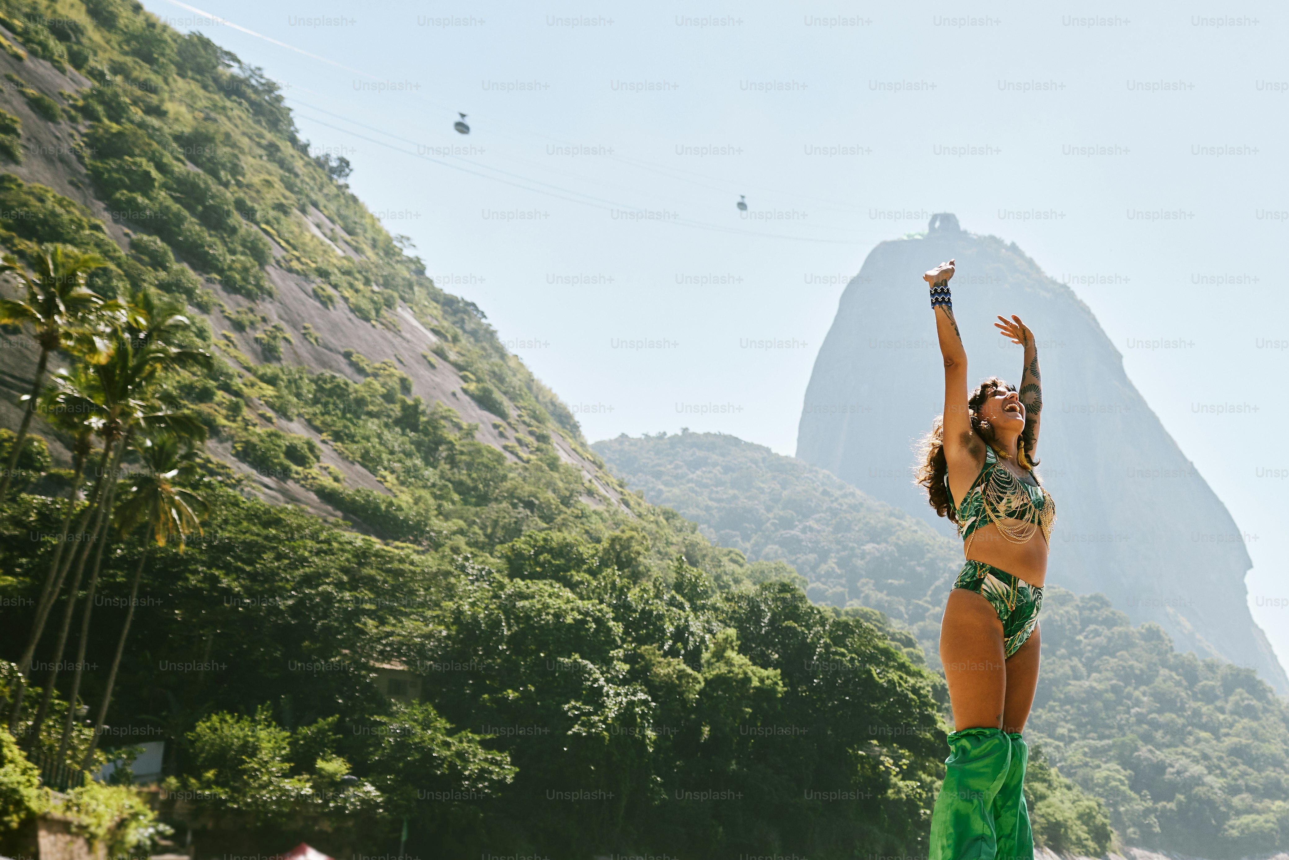 a woman in a bikini standing on a beach