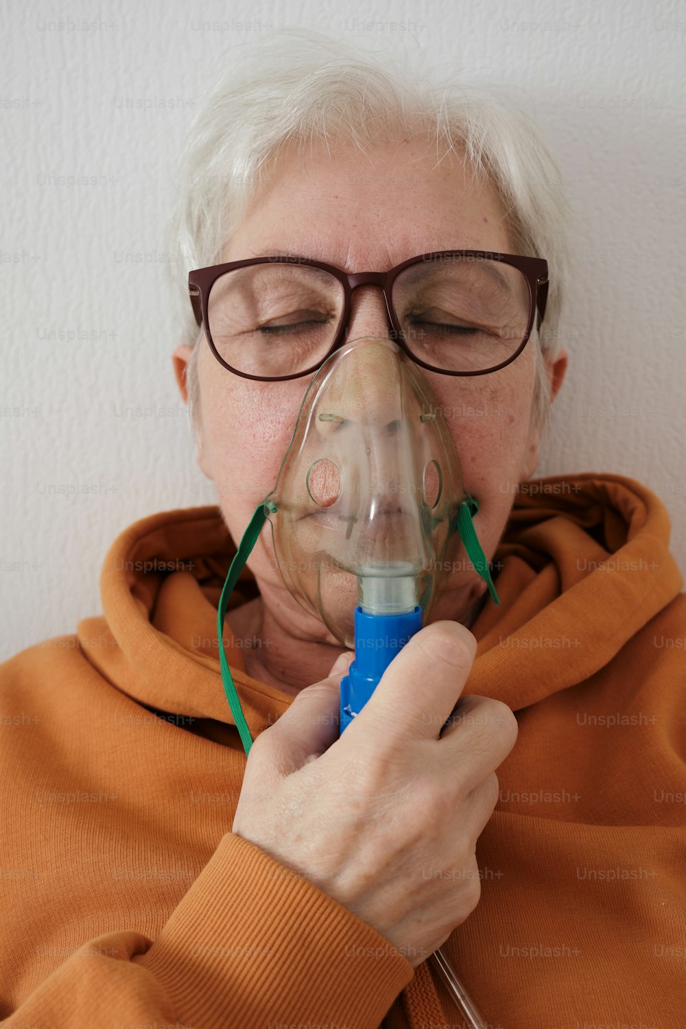 a woman with glasses and a mask on