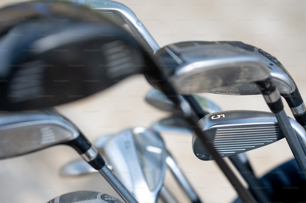 a close up of a set of golf clubs