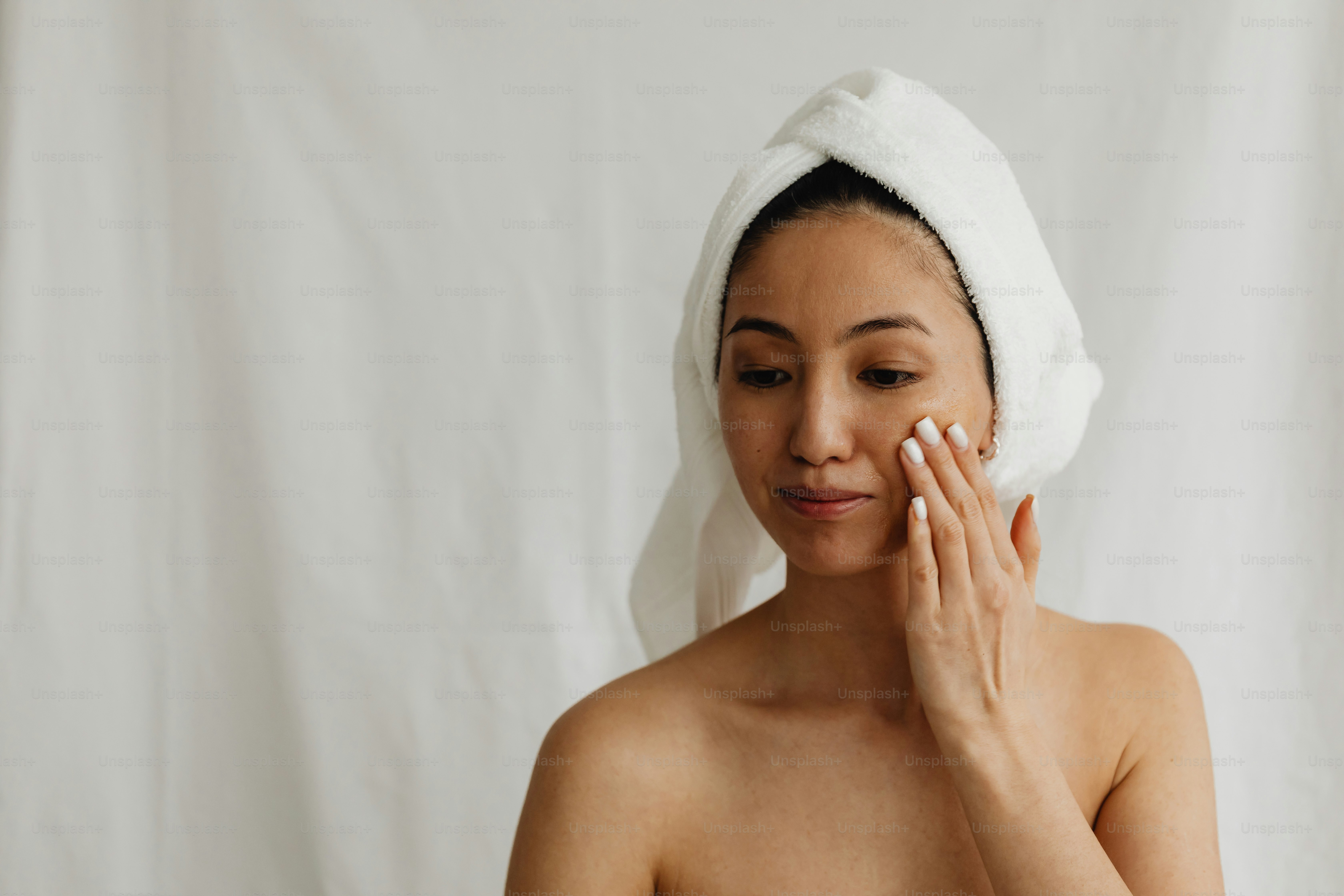 a woman with a towel on her head and a towel on her head