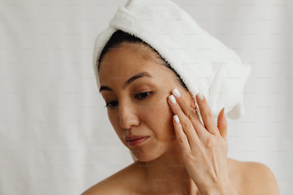 a woman with a towel on her head and a towel on her head