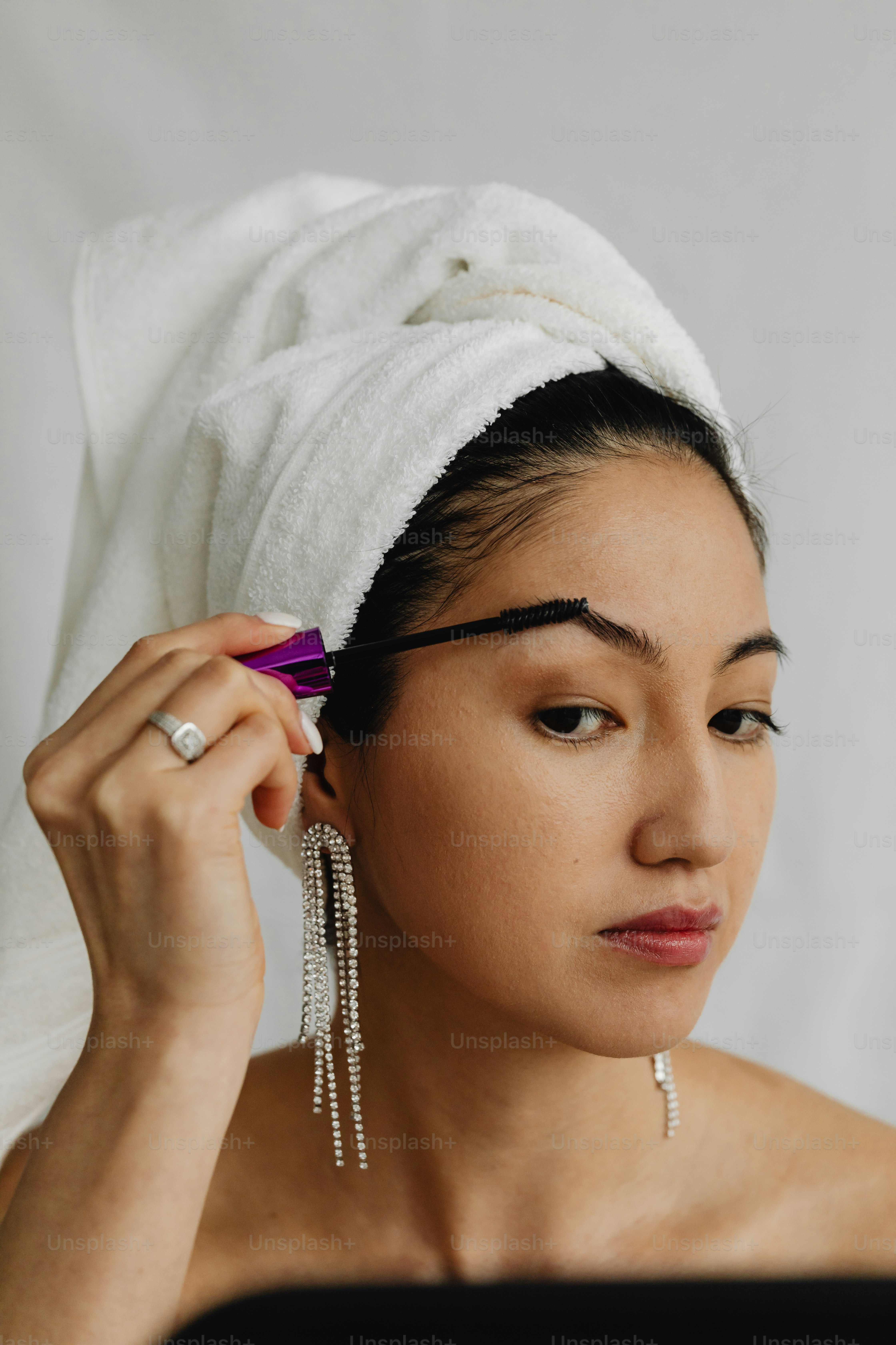 a woman with a towel wrapped around her head