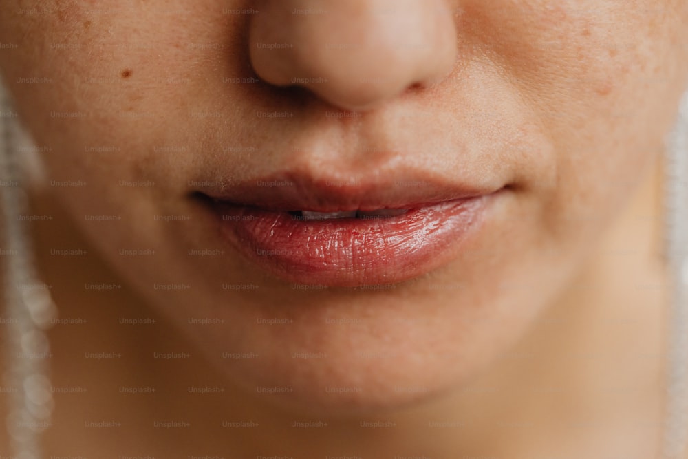 a close up of a woman's face with freckles