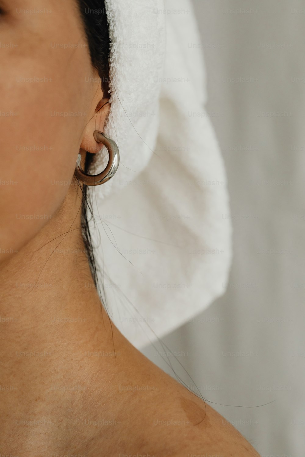 a close up of a person wearing a towel