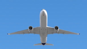 a large jetliner flying through a blue sky