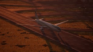 a large jetliner flying over a runway at night