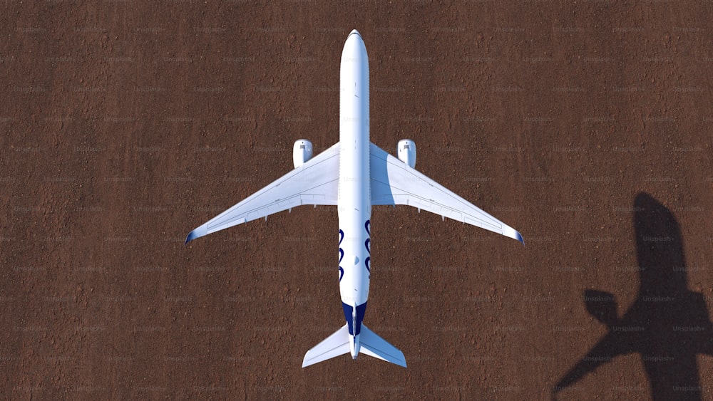an aerial view of a plane on a runway