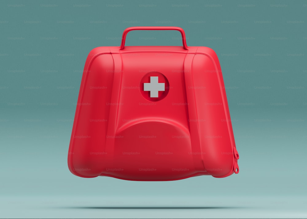 a red suitcase with a white cross on it