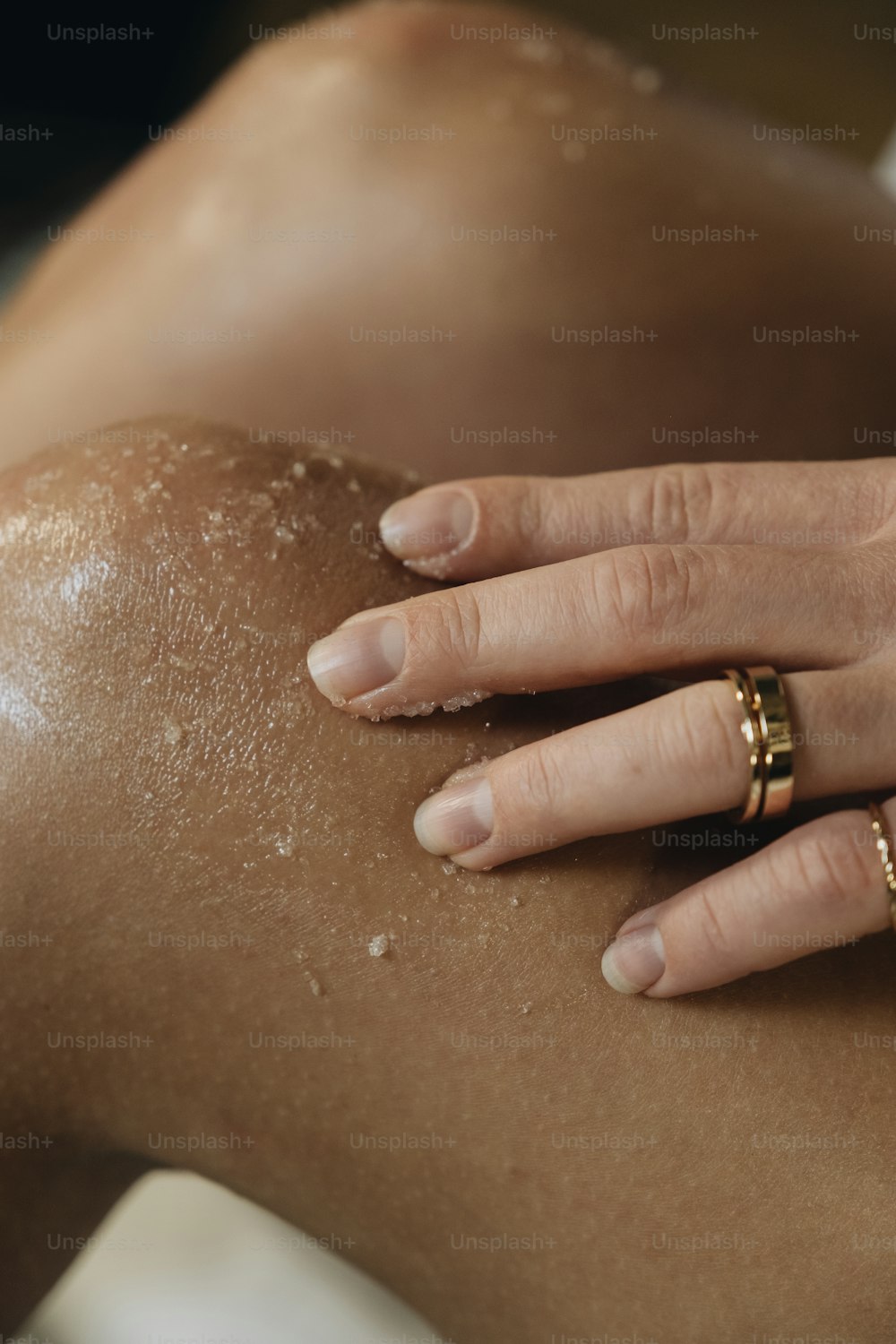a close up of a person's hand on the back of a woman '
