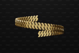 Gros plan d’un bracelet en or sur fond noir