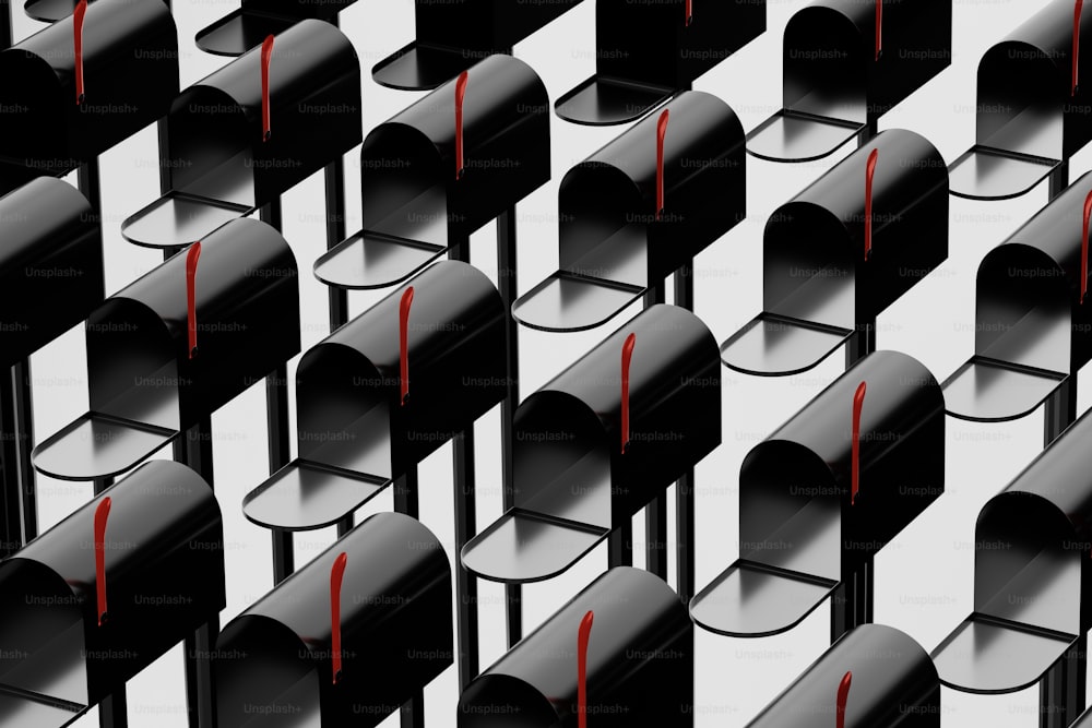 a group of black chairs with red marks on them