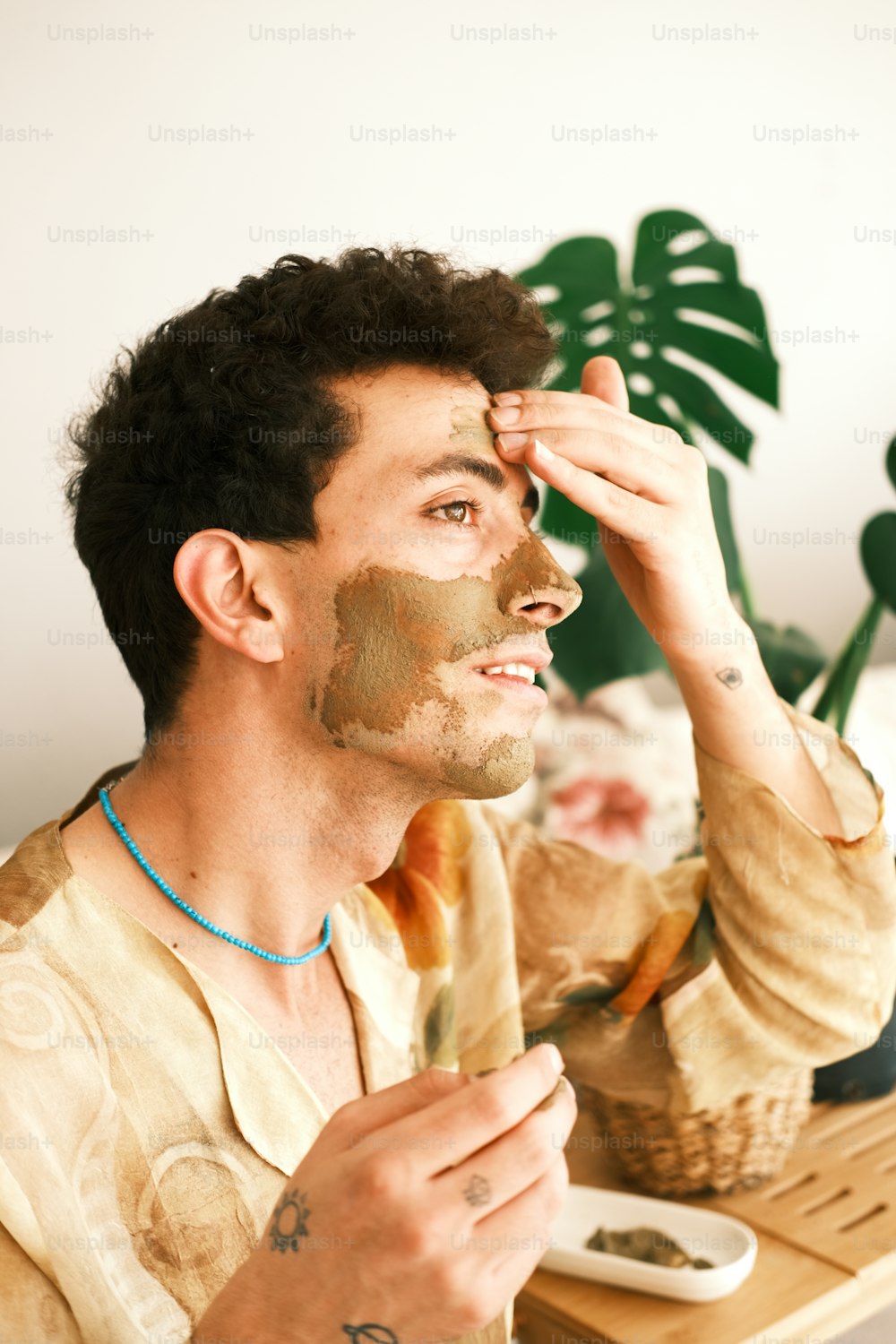 a man with a facial mask on his face