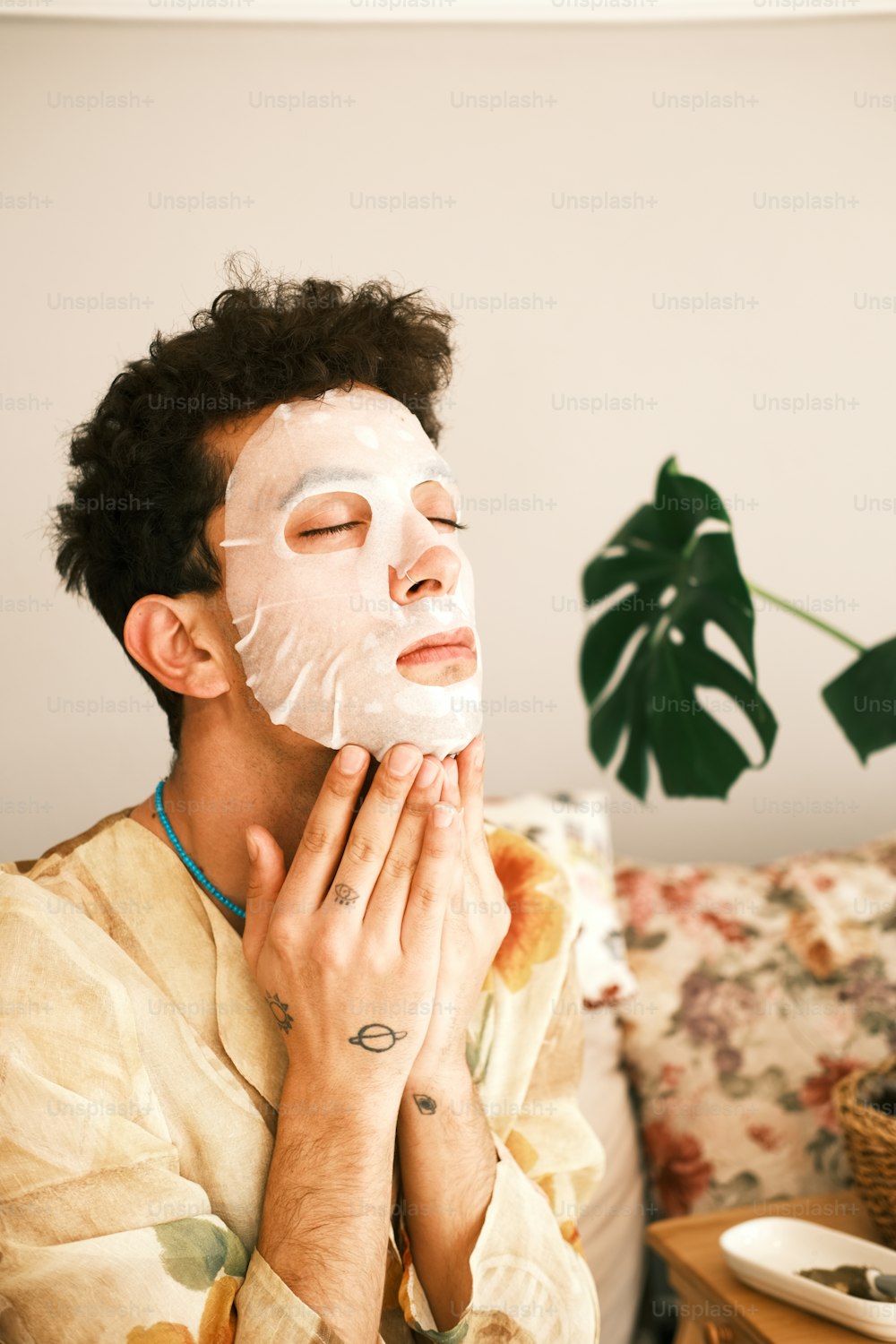 a man with a facial mask on his face