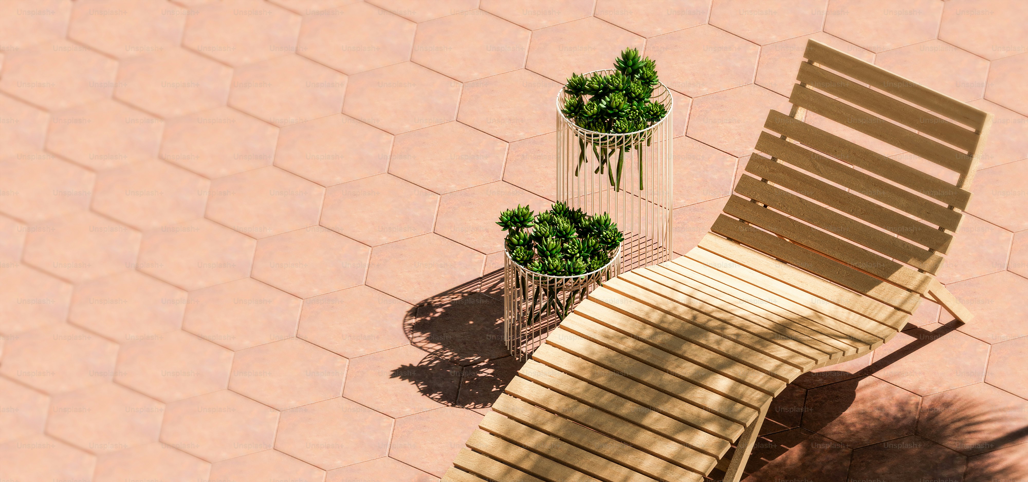 a wooden bench sitting next to a potted plant