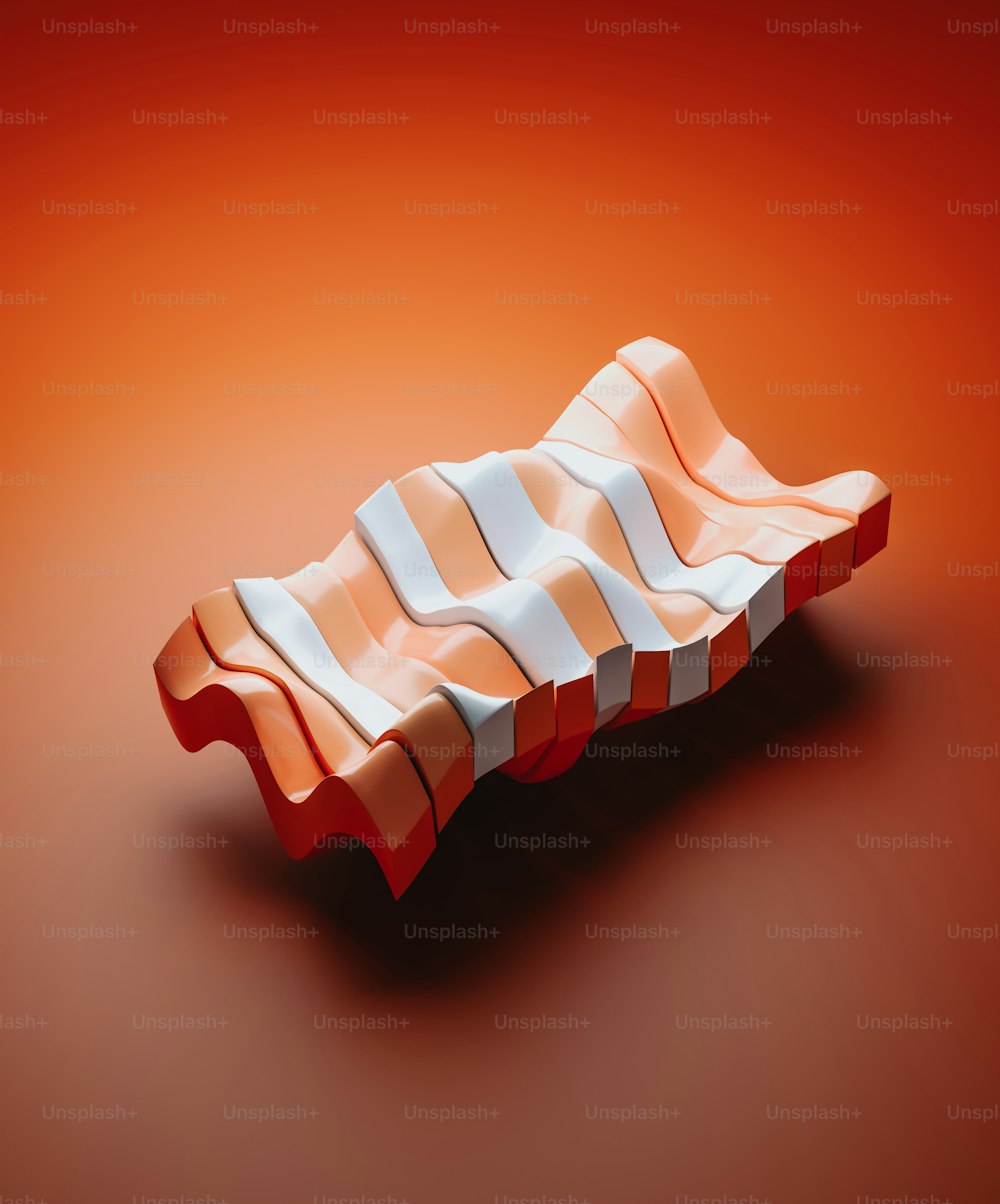 an orange and white object on a red background