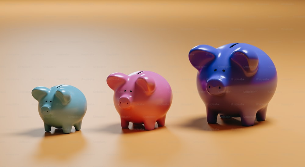 three small piggy banks sitting next to each other on a table