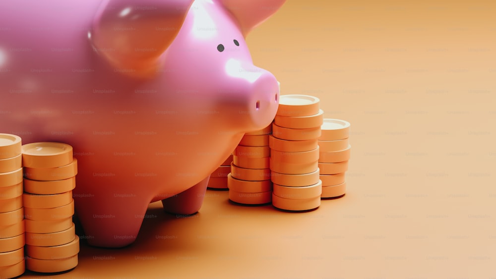 a piggy bank sitting next to stacks of coins