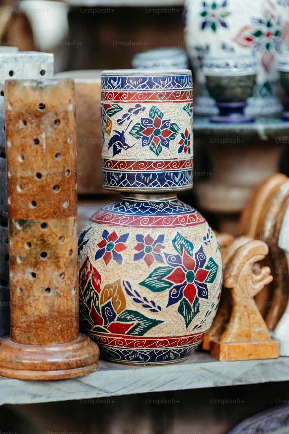 a group of vases sitting on top of a table